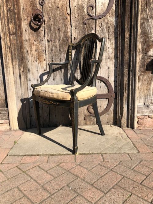 late 19th century ebonised and decorated shield back openarm armchair